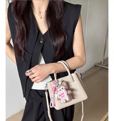 حقيبة يد نسائية صغيرة أنيقة مع حليّة جذابة لون بيج - KSA